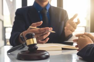 Attorney reviewing information with client and gavel